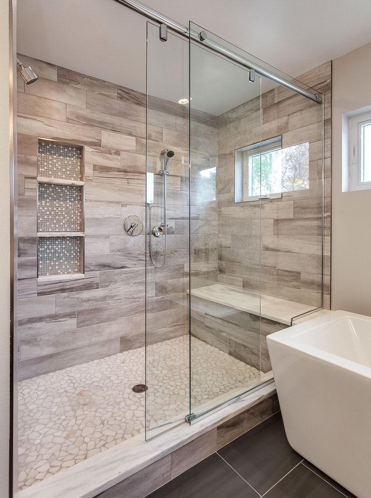 Modern walk-in shower with wood-look tile and sliding glass door